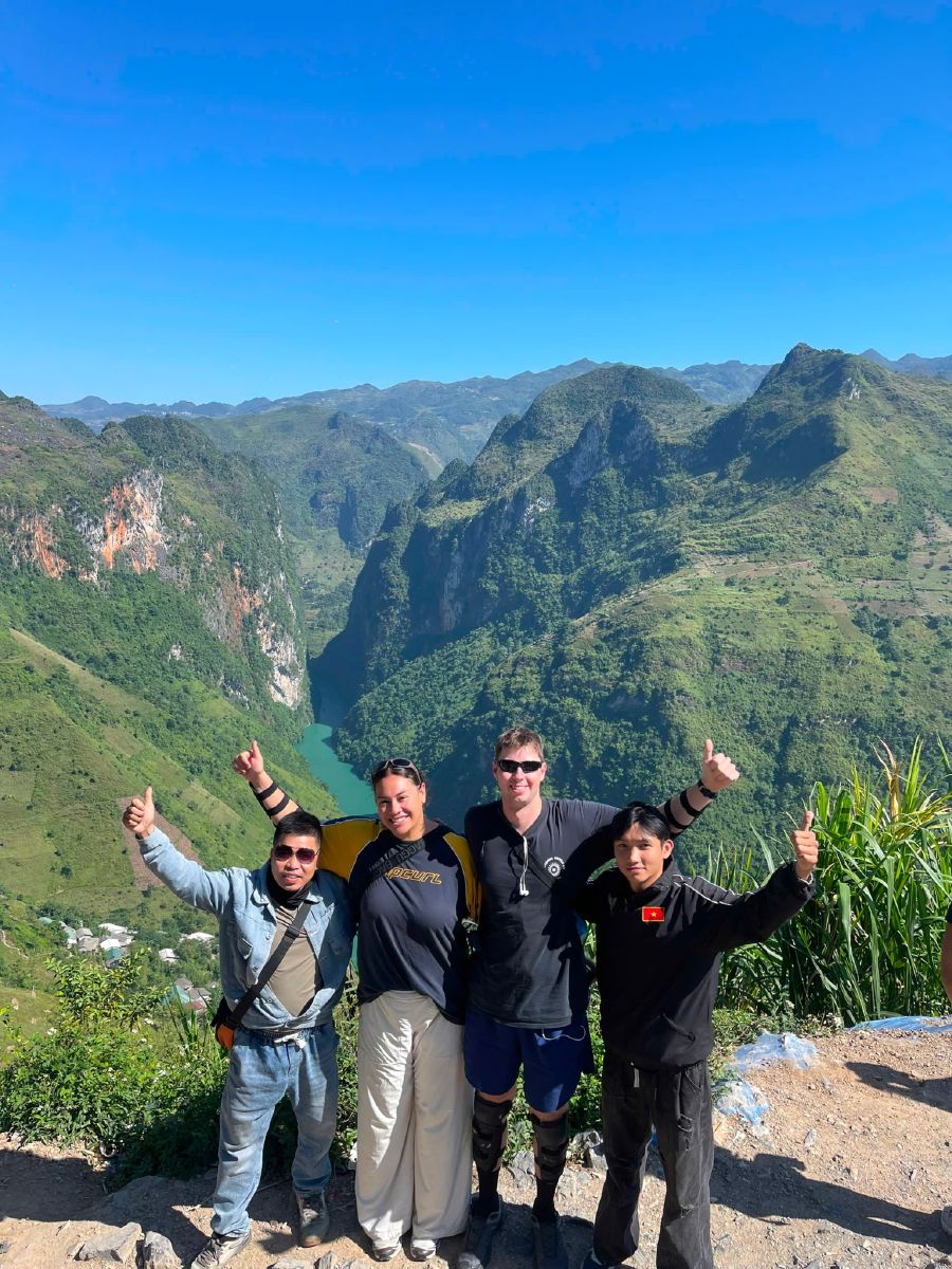 ha giang cao bang loop rice terraces group Guests-with-motorbikes-in-front-of-golden-rice-terraces-on-the-Ha-Giang-Loop